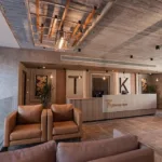 Lobby lounge with leather seating at TK Suites
