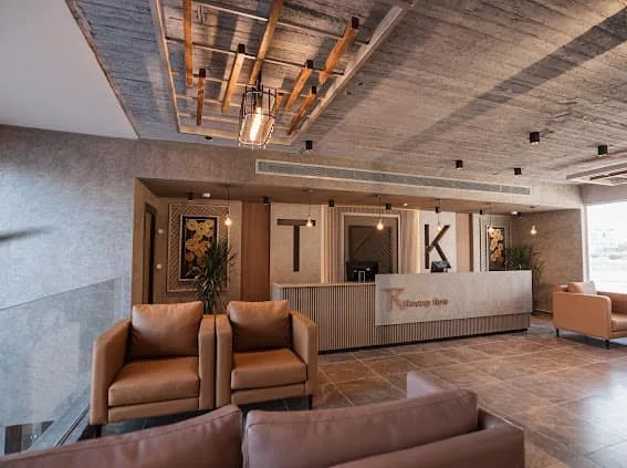 Lobby lounge with leather seating at TK Suites
