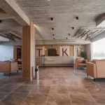 Open-plan lobby with lounge areas at TK Suites
