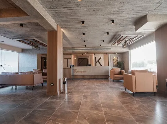 Open-plan lobby with lounge areas at TK Suites
