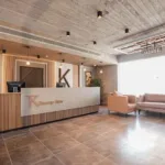 Reception desk with TK lettering and lobby seating