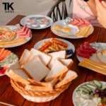 Breakfast spread with eggs, cheese and bread at TK Suites