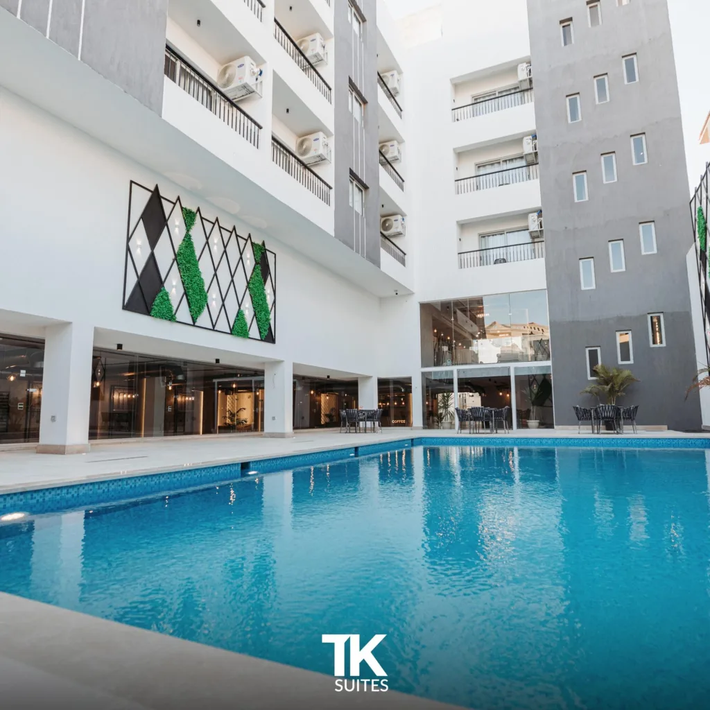 TK Suites swimming pool and courtyard on a sunny day